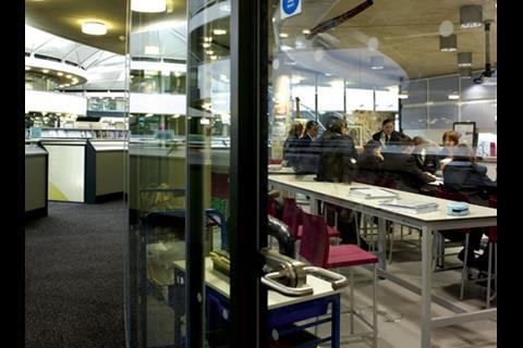 Glass partitions offer views into classrooms